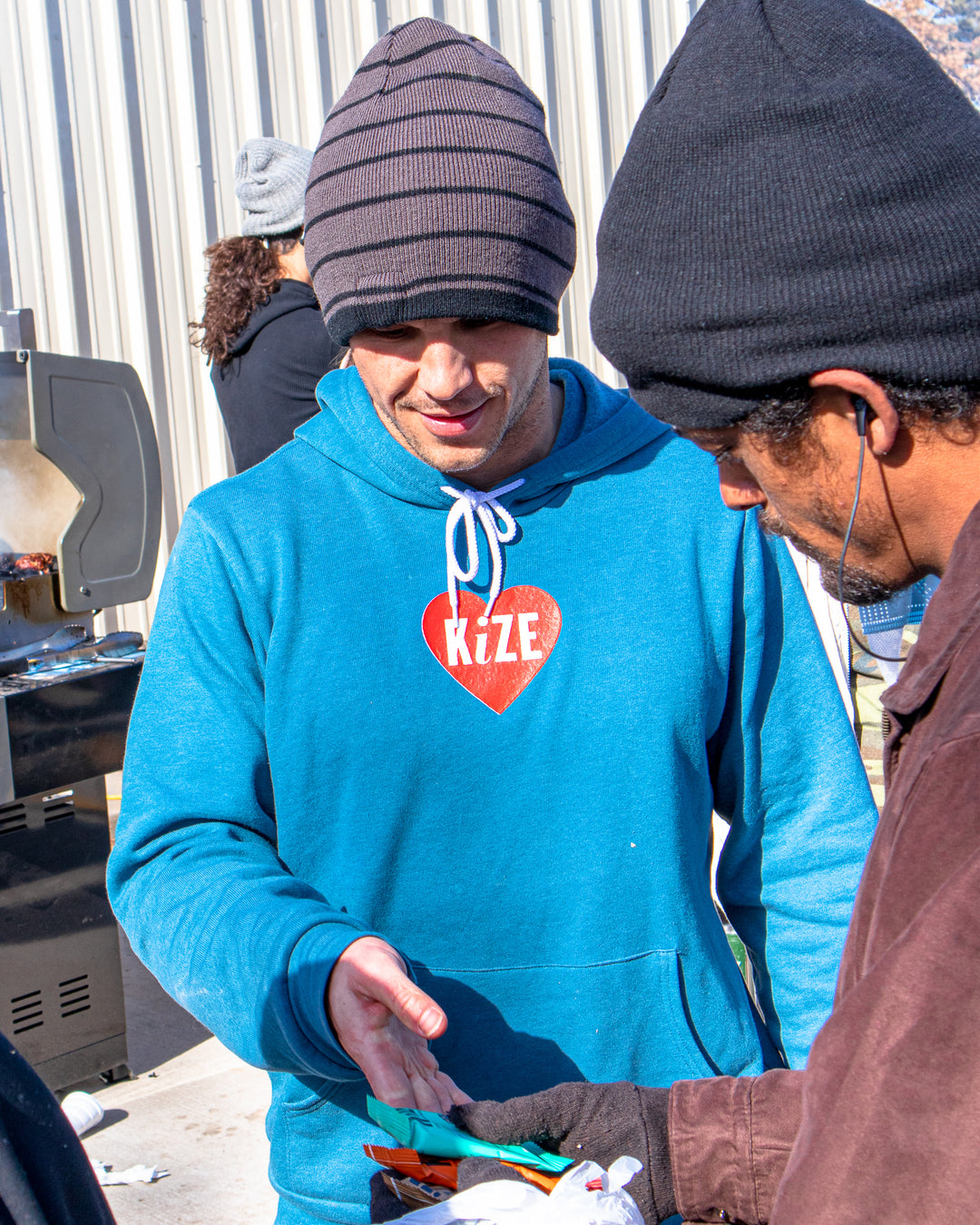 Owner Jeff Ragan handing out free KiZE bars