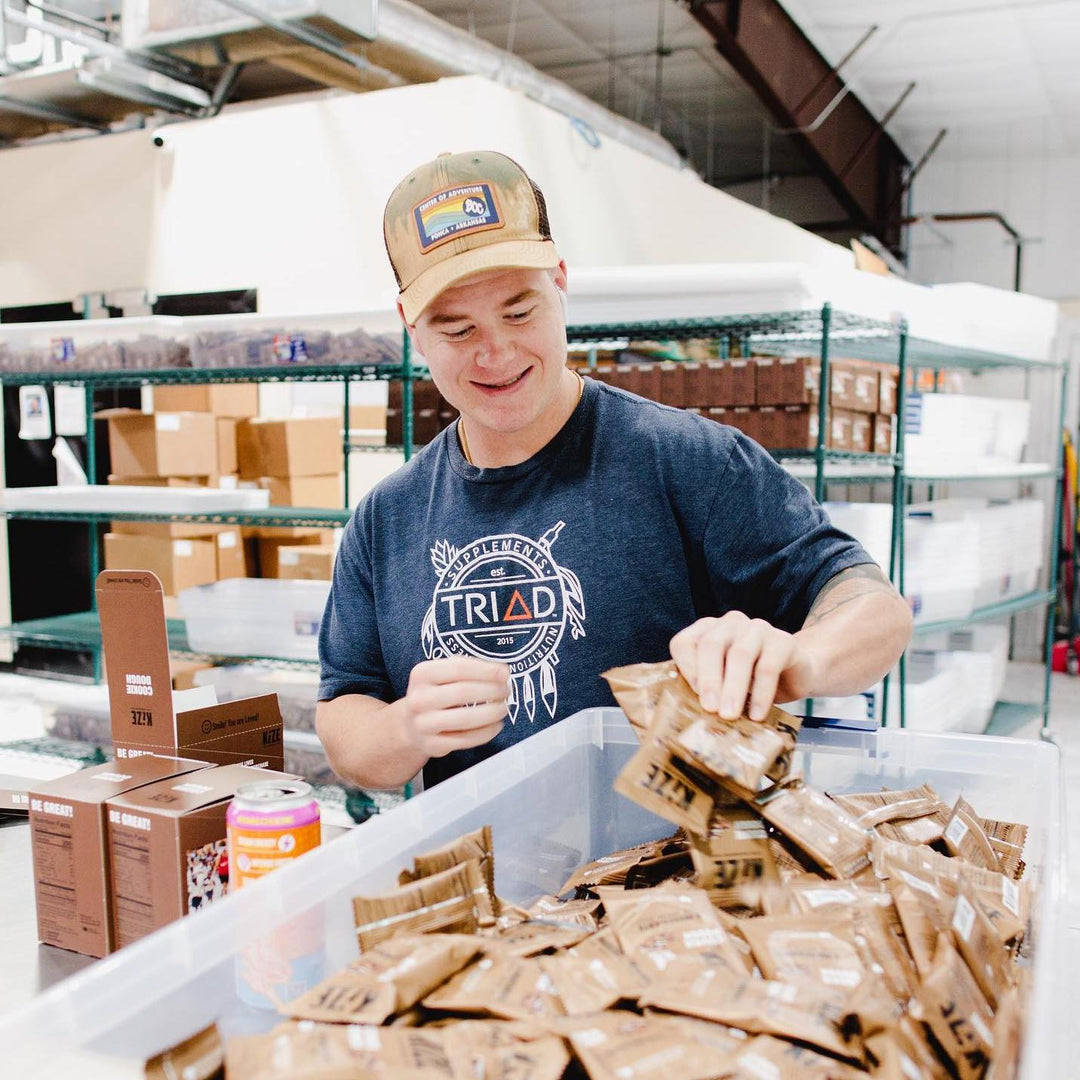 Kize Employee Filling Boxes with Bars