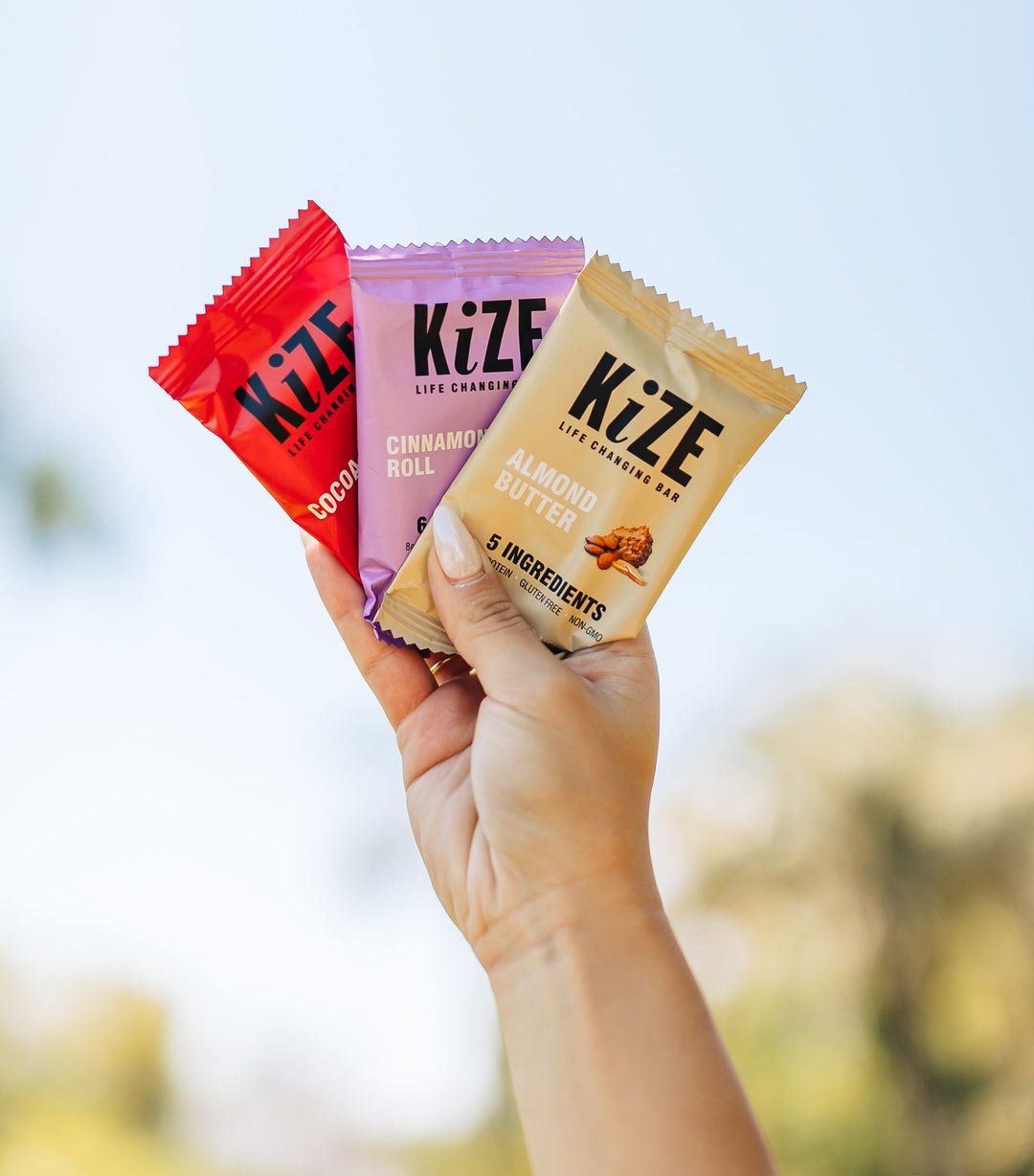Hand Holding Kize Bars in the Air