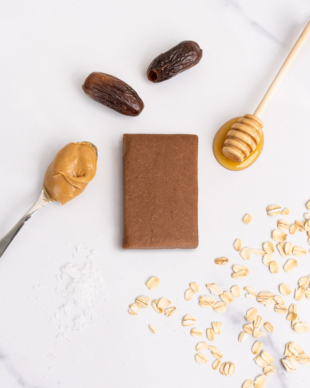 Peanut Butter Honey Kize Protein Bar Unwrapped Next to Ingredients